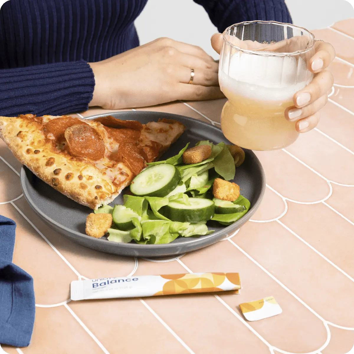 Unicity Balance stick pack next to plate of food