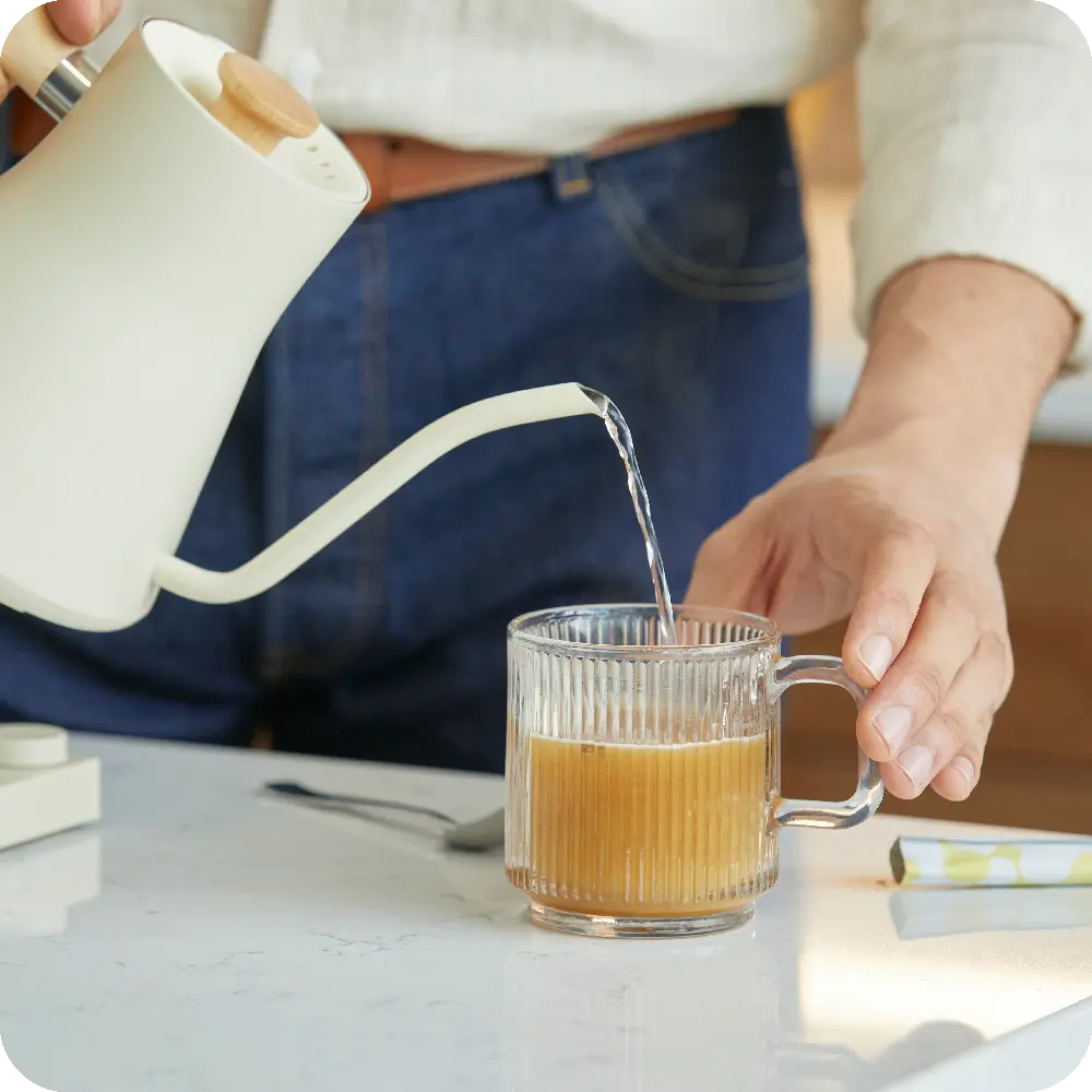 Person making cup of Unimate