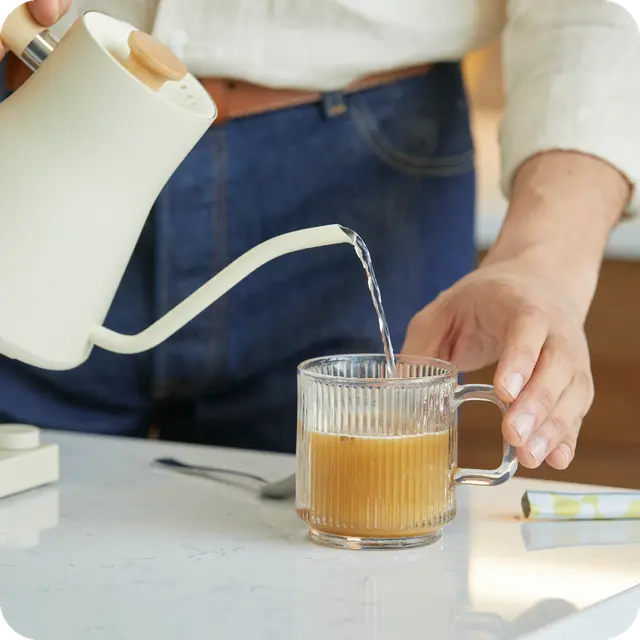 Person making glass of Unimate