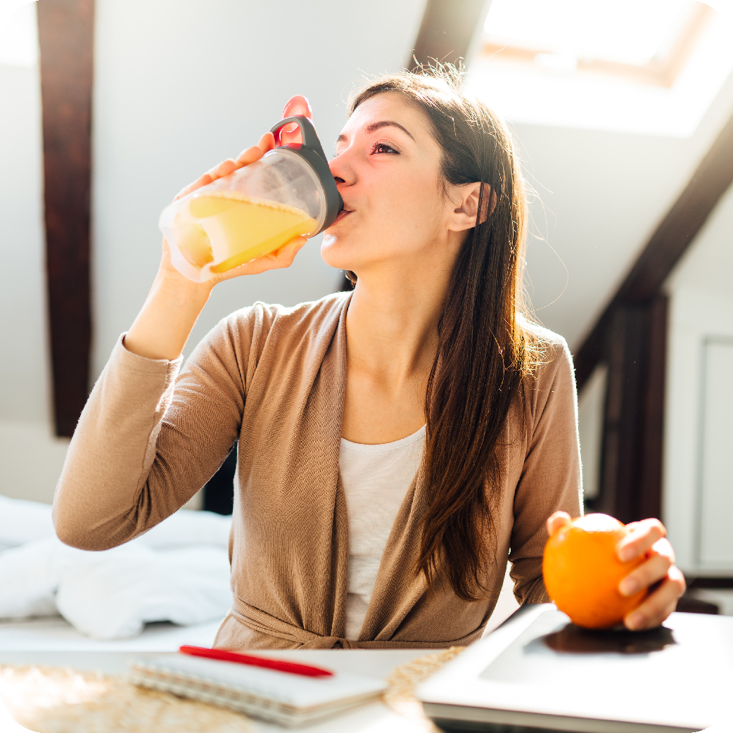 Holding glass of Balance next to food