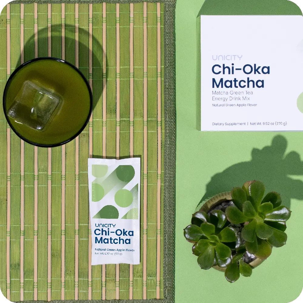 Glass of Chi-Oka Matcha next to packet