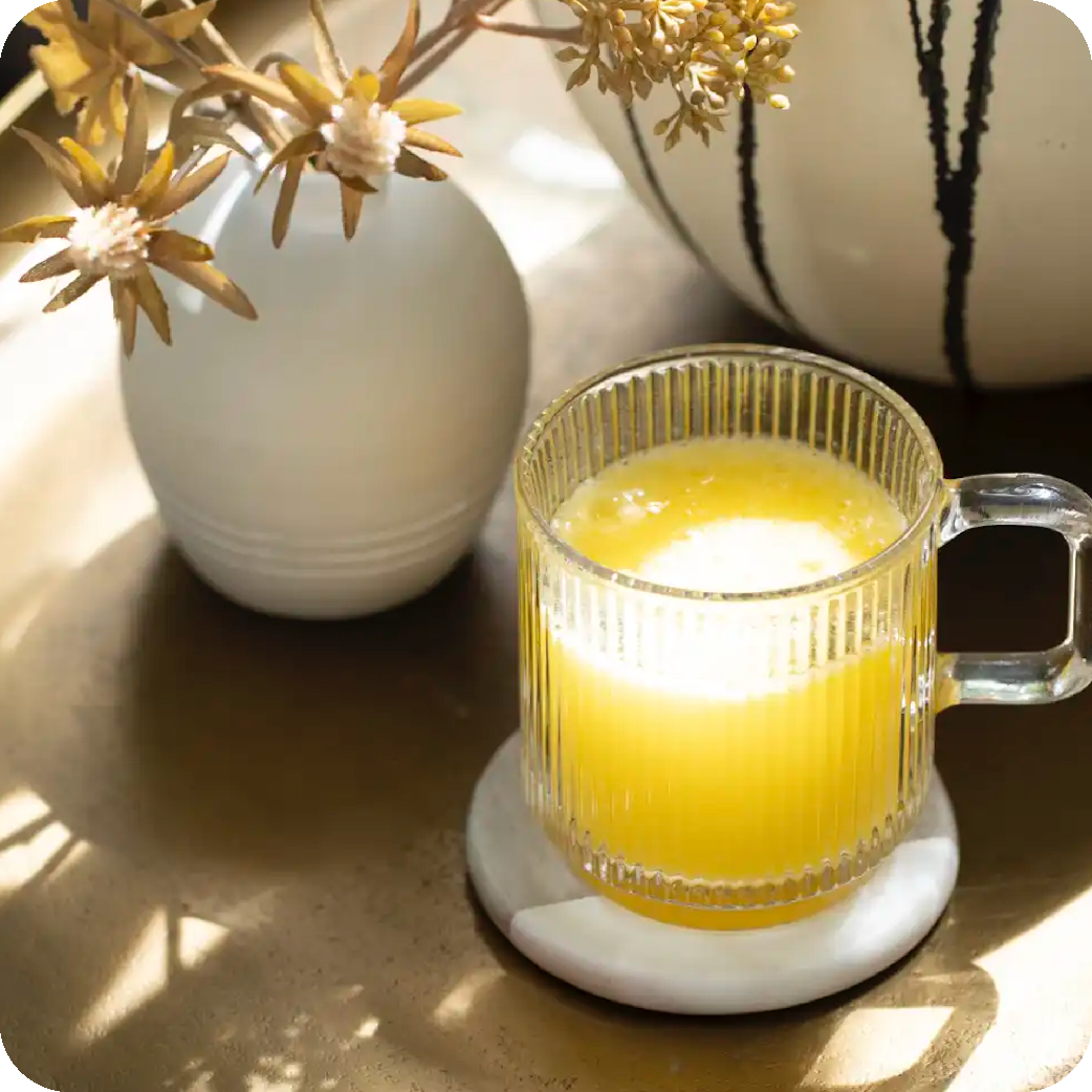 Glass of Unicity Balance next to stick pack